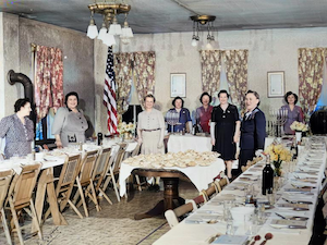 Sedar at Hovas Hocham, the Shul in Vincennes, IN. April 8, 1944.  <br><br>On back it says: Heavy set woman - Fannie Dansker ?? - Freda Dumes<br><br>In front of table back - Becky Dume and Louie Dumes. <br><br><br>